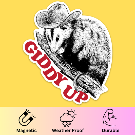 Bumper magnet featuring a possum wearing a cowboy hat on a branch with 'Giddy Up' text in red against yellow background.