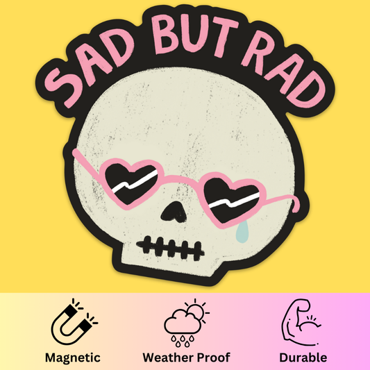 Bumper magnet featuring a skull with heart-shaped eyes wearing pink sunglasses and 'Sad But Rad' text on yellow background.