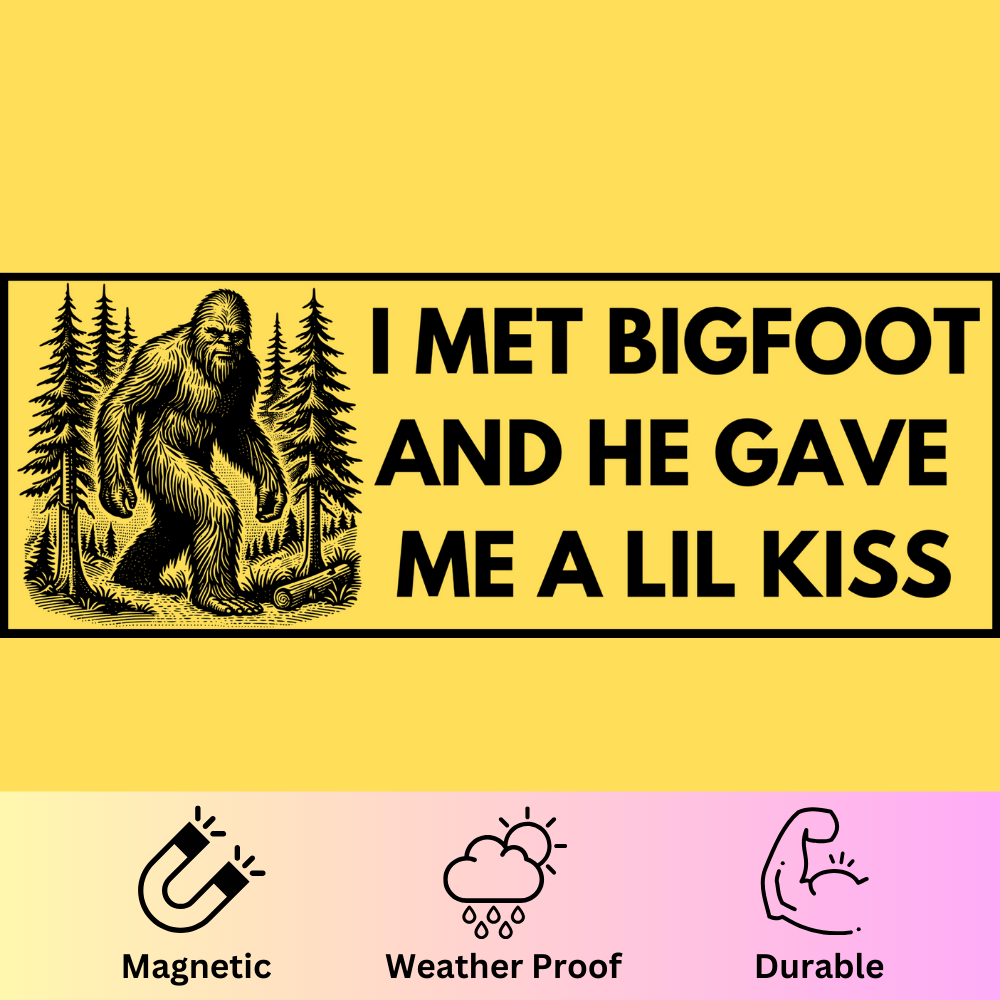 Bumper magnet featuring Bigfoot in forest with text 'I Met Bigfoot and He Gave Me a Lil Kiss' on yellow background.