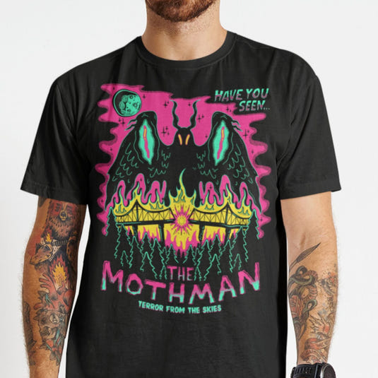 Black graphic tee featuring neon mothman with glowing wings, horns, and 'The Mothman' text against pink and black background.