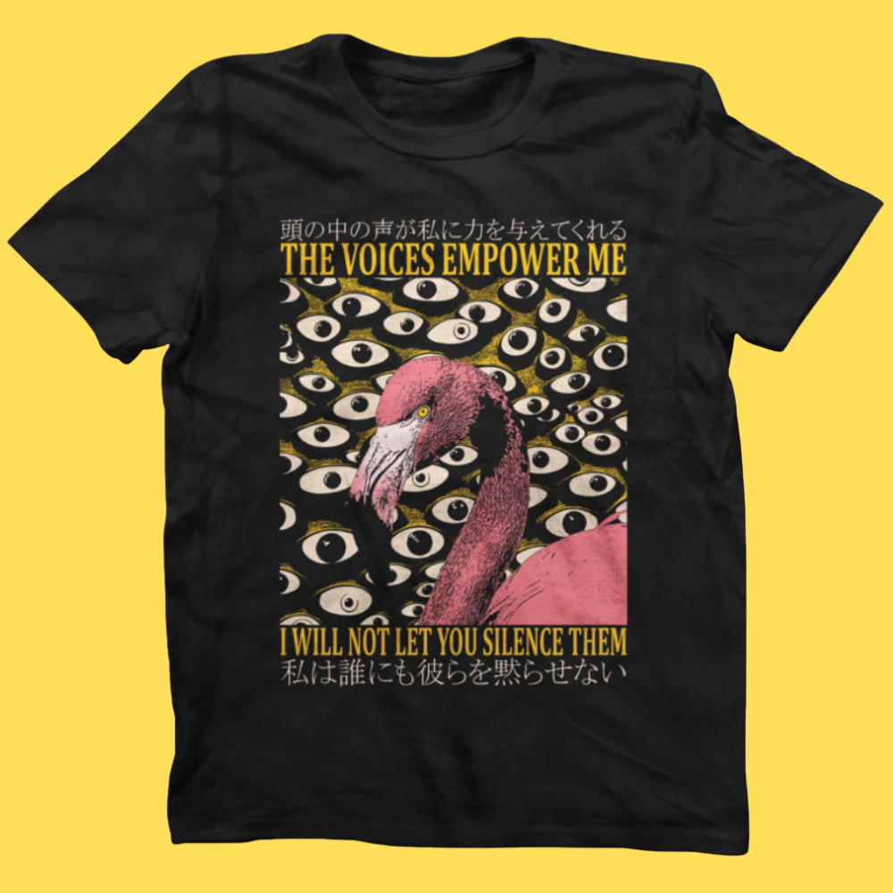Black graphic tee featuring a pink flamingo surrounded by eyes, with text 'The Voices Empower Me' and 'I Will Not Let You