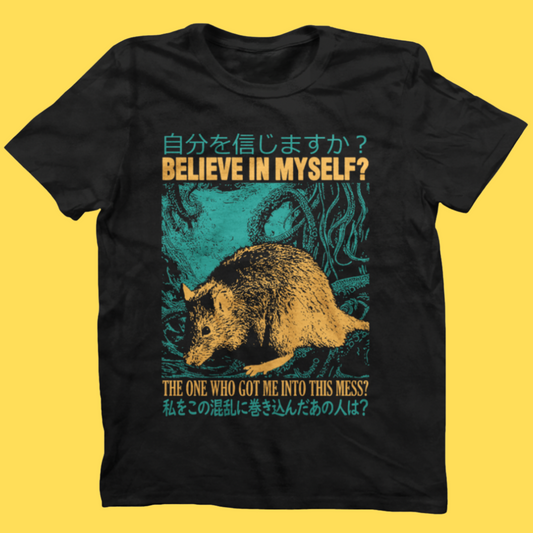 Black graphic tee with yellow possum illustration and turquoise Japanese text, featuring 'BELIEVE IN MYSELF?' message on