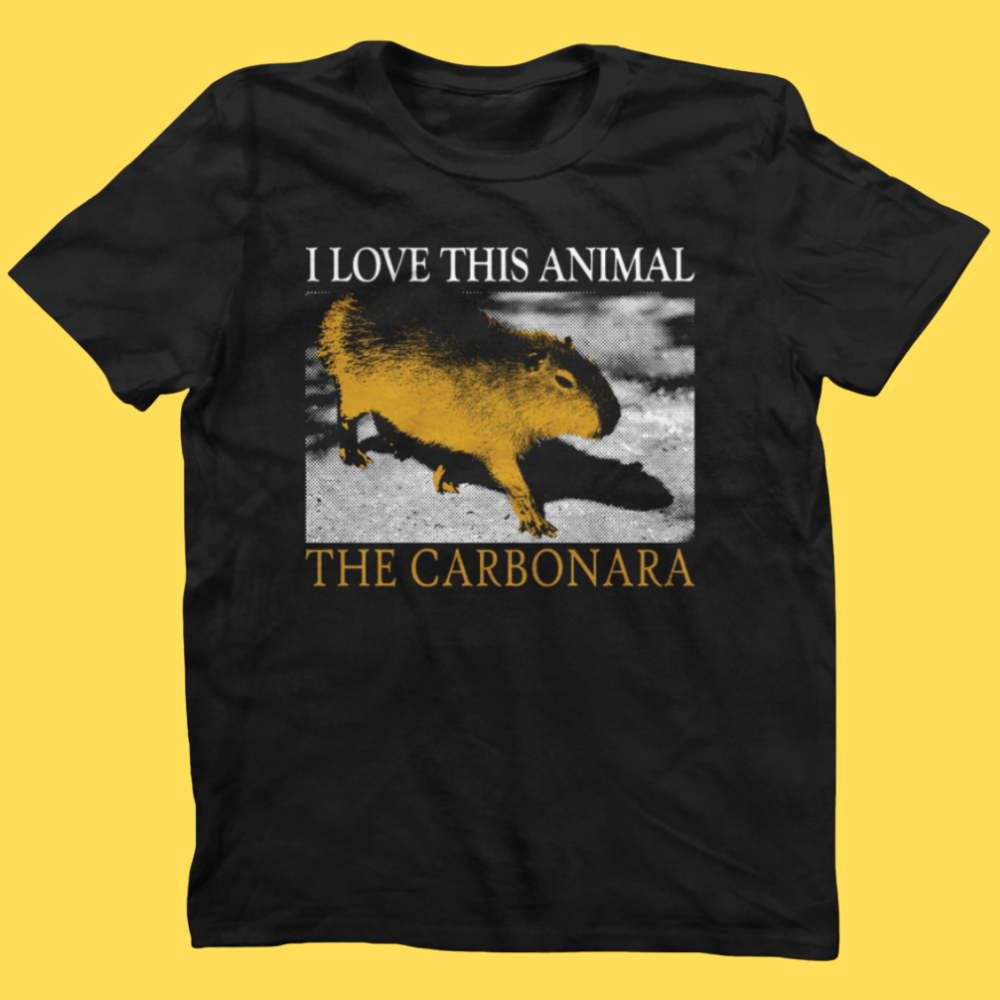 Black graphic tee featuring a golden capybara with 'I LOVE THIS ANIMAL THE CARBONARA' text on yellow background.