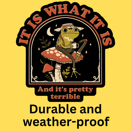 Vinyl sticker featuring a whimsical frog on a mushroom holding coffee under moonlight. Text reads 'It Is What It Is And it's