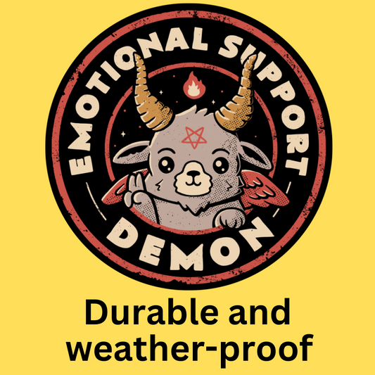 Vinyl sticker with cute demon character, horns, and flame design in vintage style. Text reads 'Emotional Support Demon'.