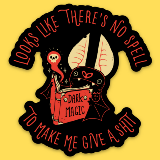 Vinyl sticker featuring a dark magical creature holding a spellbook with text 'Looks like there's no spell to make me give a