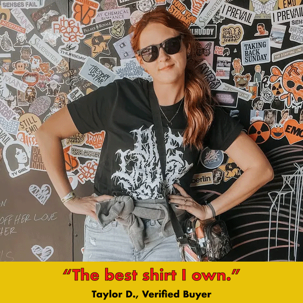 Black graphic tee featuring 'Live Laugh Love' text with artistic design, styled with sunglasses and accessories against