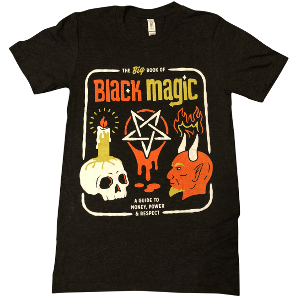 A black t-shirt that reads the big book of black magic: a guide to money, power, and respect with icons of a pentagram, devil head, and skull with a candle burning on top of it