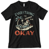 graphic tee of skeleton resting in a coffin sipping a drink on a beach with a palm tree nearby with text everything is gonna be okay