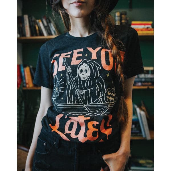 woman wearing black shirt with see you later text with the grim reaper in the world of the dead